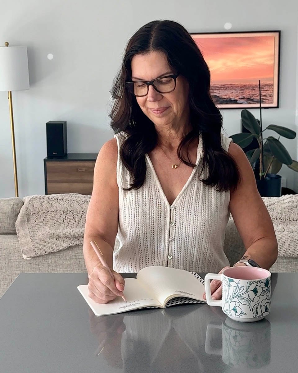 Courtney writing at table