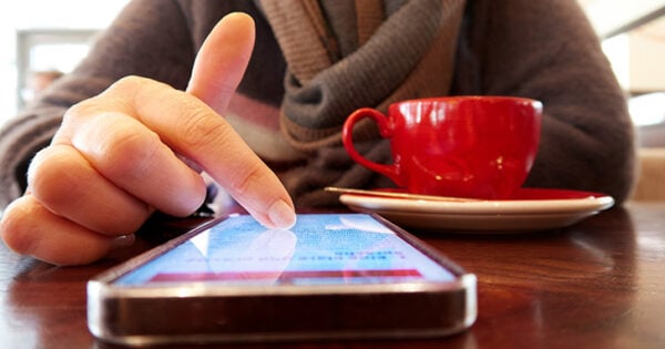 Woman scrolling on phone.